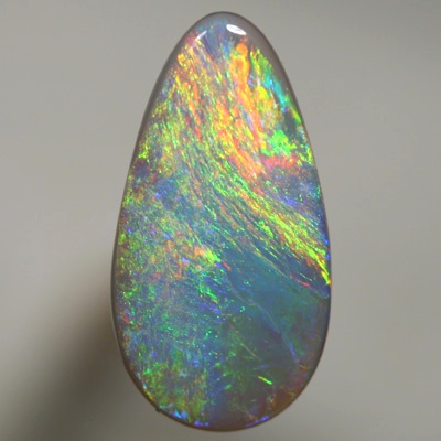 SOLID SEMI BLACK OPAL Iris pattern with gold fire. SEE VIDEO